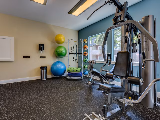 Modern fitness center with latest equipment at Onyx Apartments