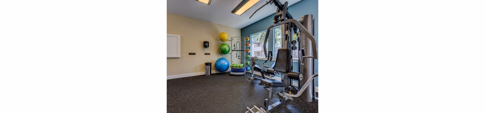 Modern fitness center with latest equipment at Onyx Apartments