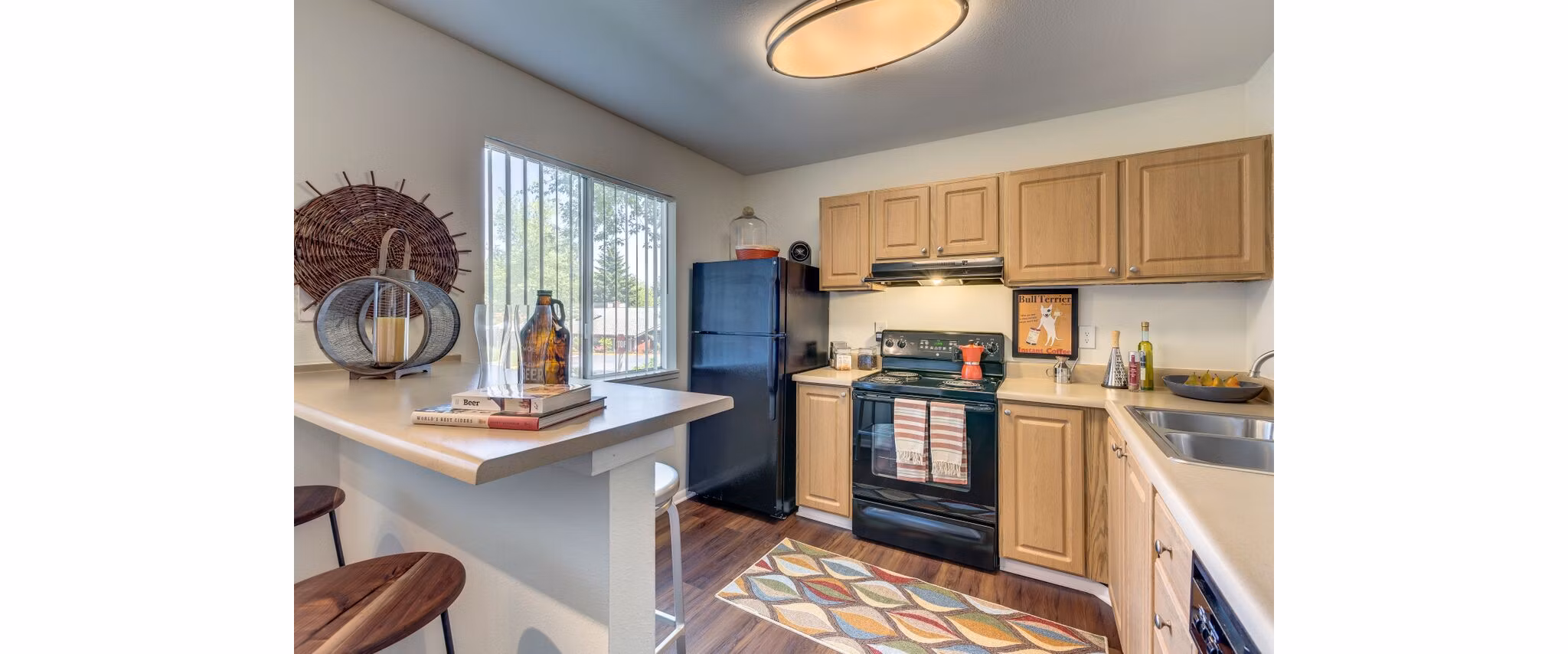 Modern kitchen with stainless steel appliances at Onyx Apartments