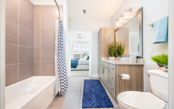 Bathroom featuring sleek fixtures and modern design at Overture Crabtree Apartments