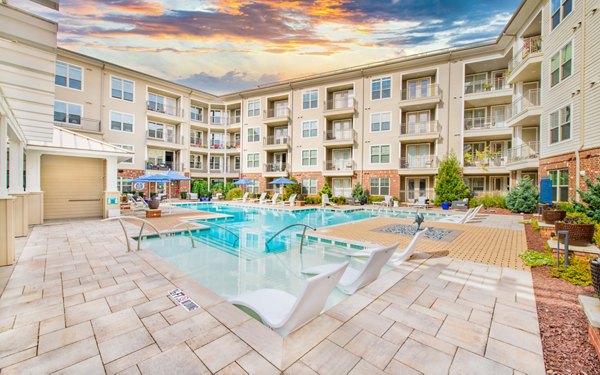 Resort-style pool with sundeck at Overture Crabtree Apartments, perfect for relaxation and social gatherings
