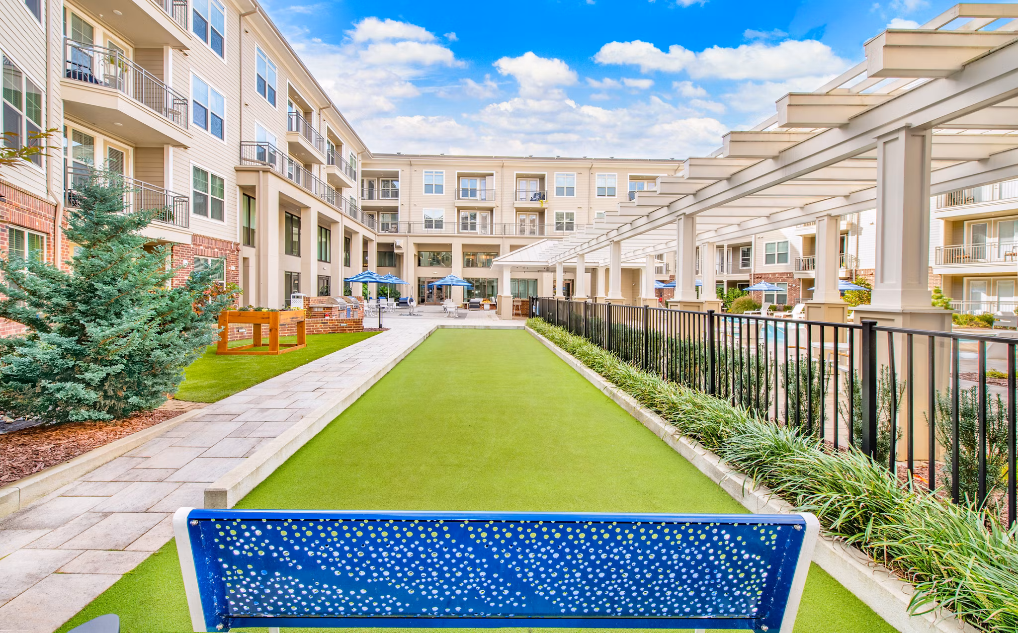 Courtyard with landscaped gardens at Overture Crabtree Apartments offering a serene outdoor space