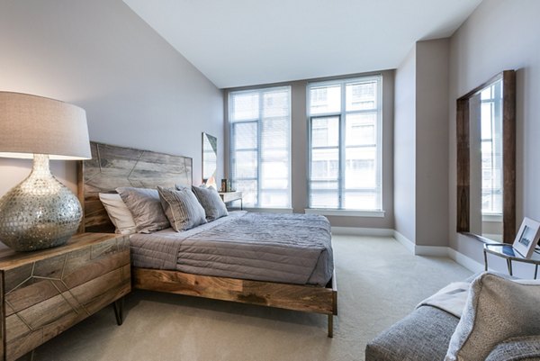 Cozy bedroom with modern decor and natural light in Greystar luxury apartments