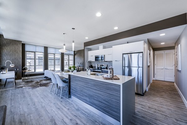 Modern kitchen with stainless steel appliances in Greystar luxury apartments