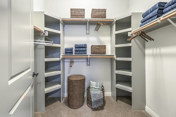 Spacious bedroom closet with built-in shelving at Overture Fairview Apartments for convenient storage