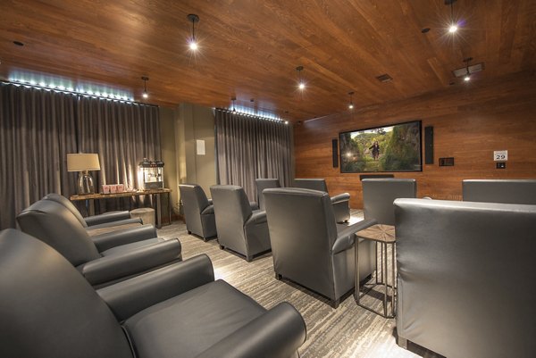 Theater for residents at Overture Fairview Apartments featuring plush seating and state-of-the-art audiovisual equipment