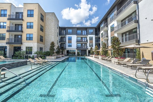 Rooftop pool with lounge seating at Overture Fairview luxury apartments