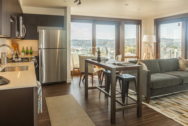 Spacious living room with modern decor in Ballard Public Lofts & Market Apartments