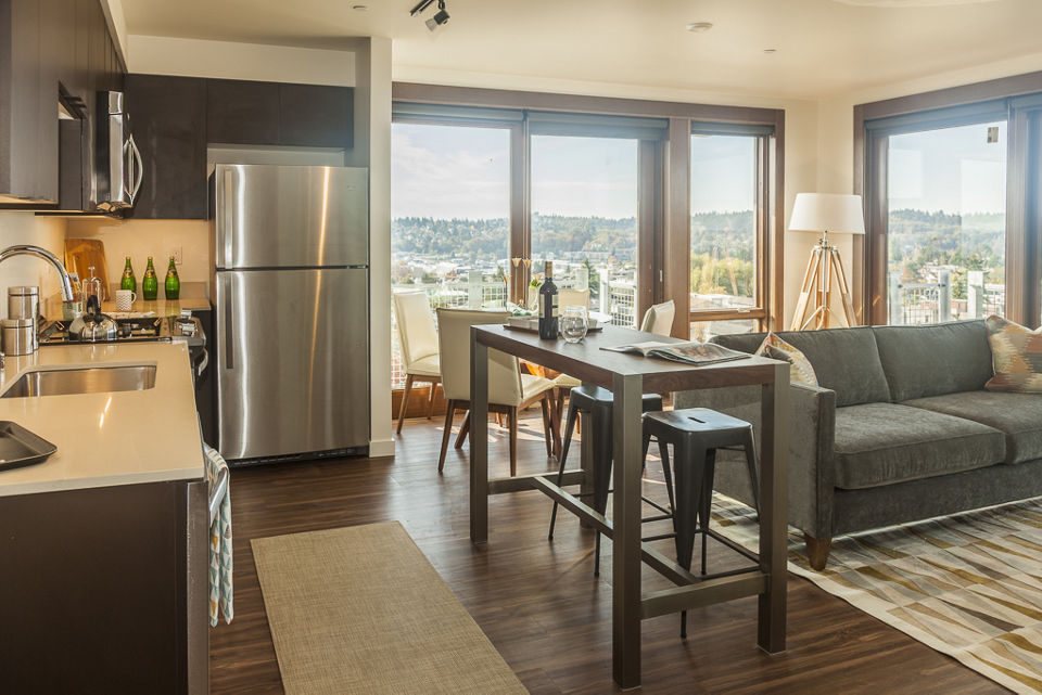 Spacious living room with modern decor in Ballard Public Lofts & Market Apartments
