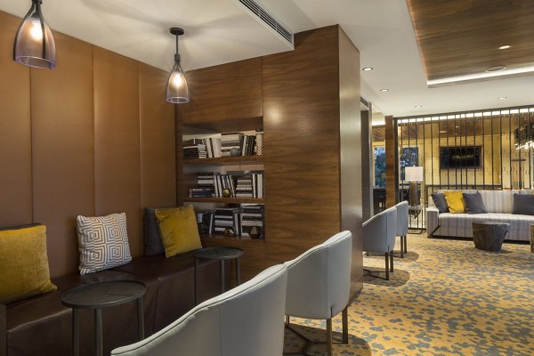 Elegant clubhouse featuring modern decor and ample seating at Serenity Apartments