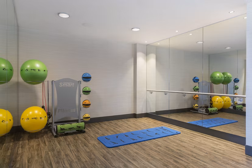 State-of-the-art fitness center with modern equipment at Serenity Apartments, luxury community offering premier amenities in an urban setting