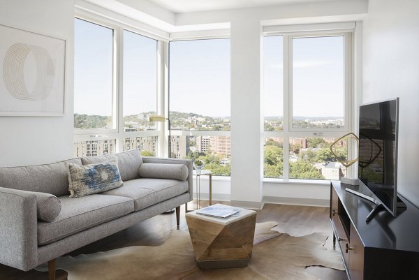 Serene living room featuring modern furnishings at Serenity Apartments