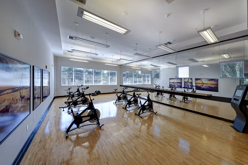 Spacious yoga/spin studio with modern equipment at Solle Davie Luxury Apartments, perfect for fitness enthusiasts seeking luxury living