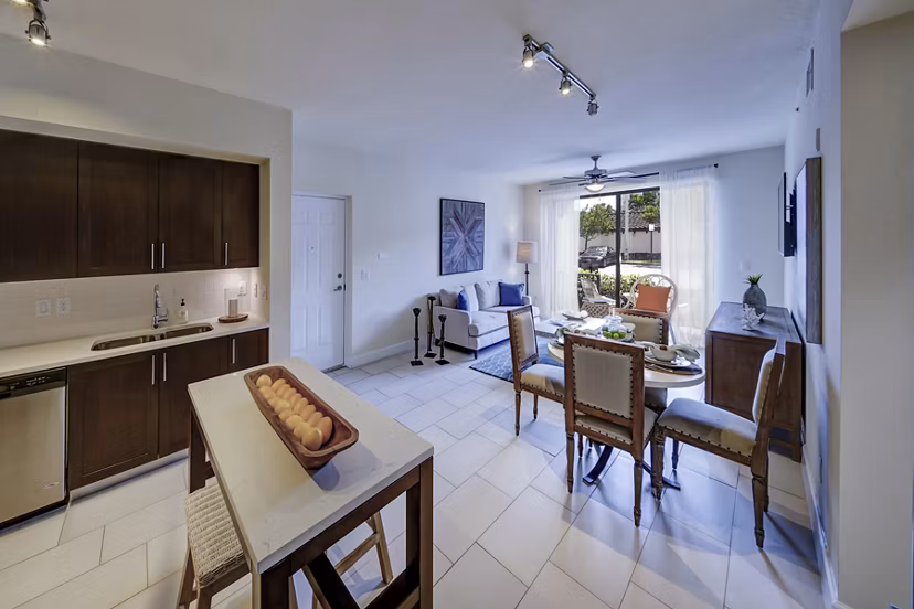 Modern kitchen with stainless steel appliances and granite countertops at Solle Davie Luxury Apartments