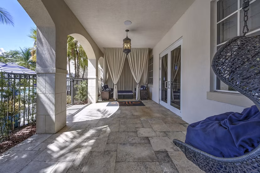 Inviting outdoor patio with modern seating at Solle Davie Luxury Apartments, perfect for relaxation and social gatherings