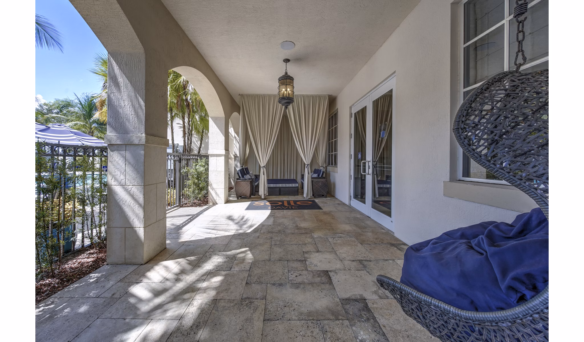 Inviting outdoor patio with modern seating at Solle Davie Luxury Apartments, perfect for relaxation and social gatherings
