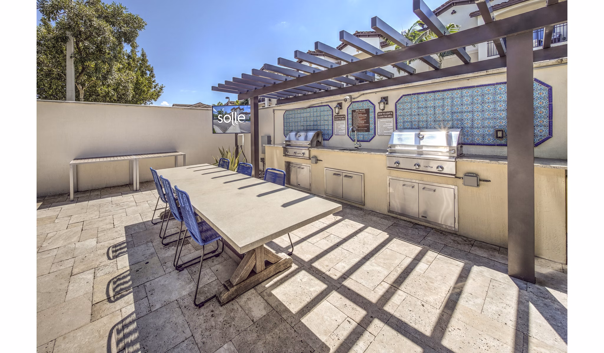 Outdoor BBQ area with modern grills at Solle Davie luxury apartments, ideal for entertaining and relaxing