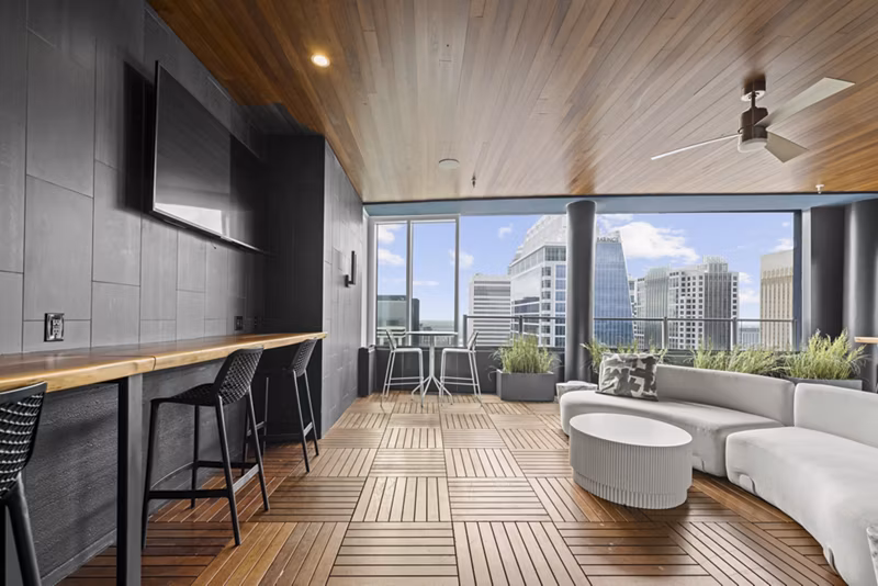 Clubhouse theater with plush seating and large screen at Ascent Uptown Apartments, perfect for entertainment in a luxury apartment setting