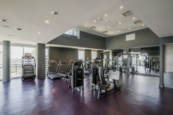 State-of-the-art fitness center at Ascent Uptown Apartments featuring cardio and strength training equipment