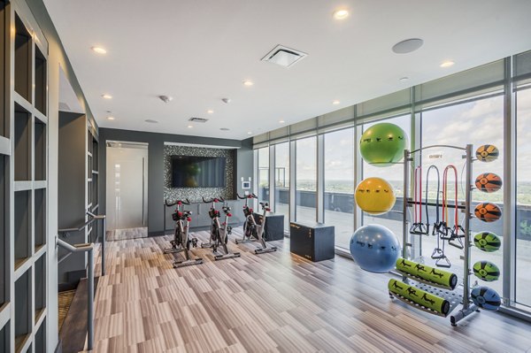 Yoga and spin center with modern equipment at Ascent Uptown Apartments provides a holistic fitness experience