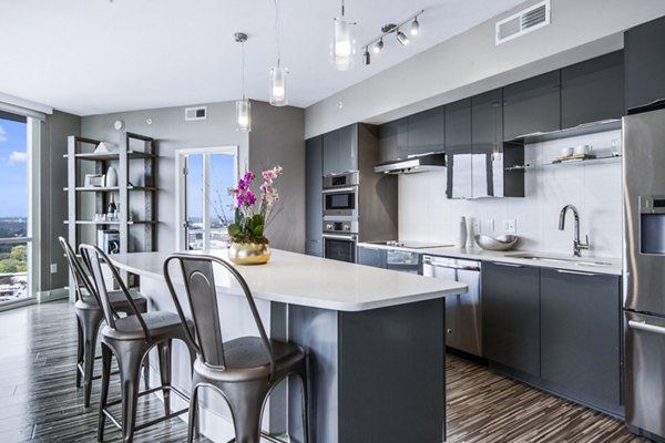 Kitchens featuring modern stainless steel appliances in Ascent Uptown Apartments