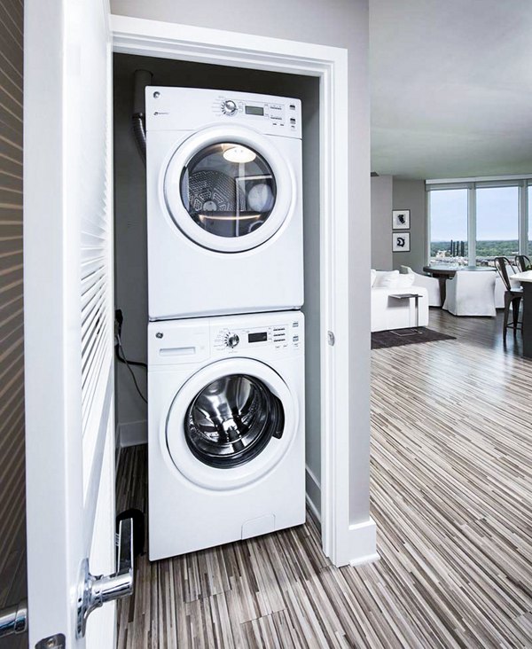 Convenient laundry room with modern appliances at Ascent Uptown Apartments, a luxurious living space in the heart of the city