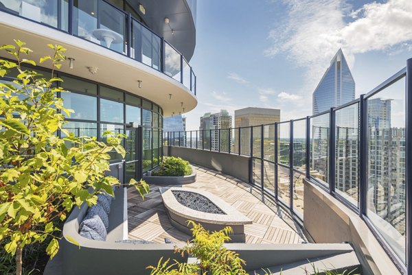 Rooftop patio with city views at Ascent Uptown Apartments: luxury outdoor space for socializing and relaxation in an urban setting