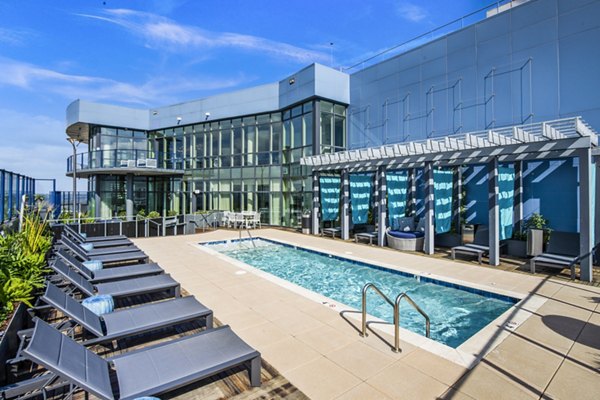 Rooftop pool with skyline views at Ascent Uptown Apartments