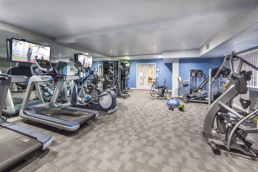 Modern fitness center with state-of-the-art equipment at Hacienda Vallecitos Apartments