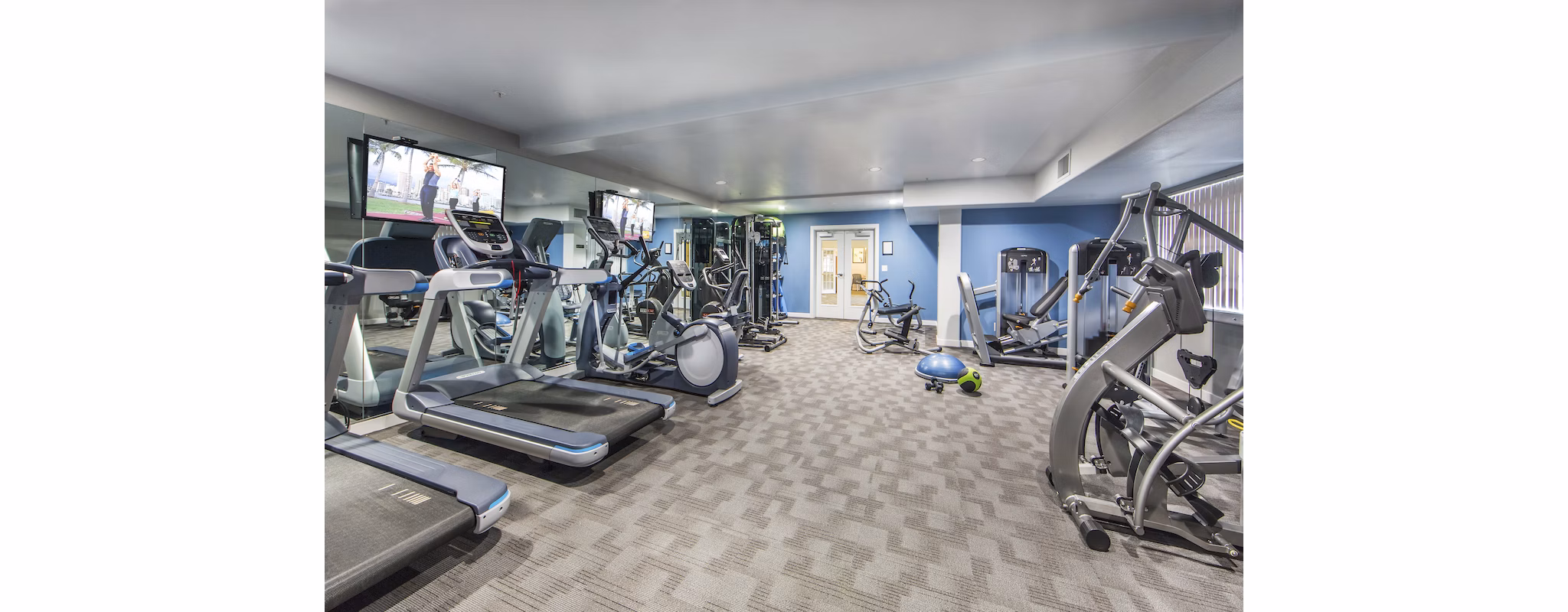 Modern fitness center with state-of-the-art equipment at Hacienda Vallecitos Apartments