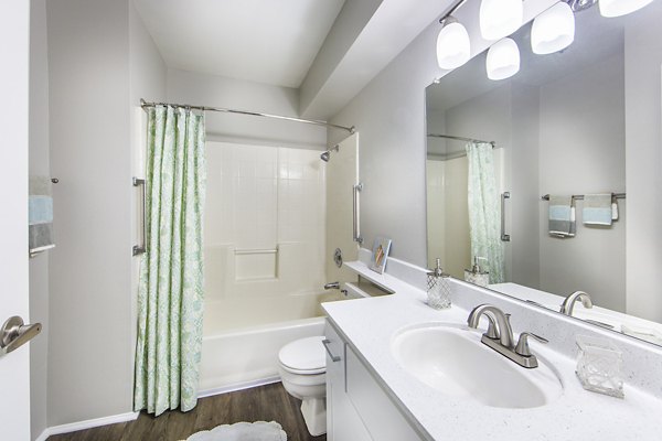 Bathroom featuring elegant fixtures and marble countertops at Overture San Marcos Apartment Homes