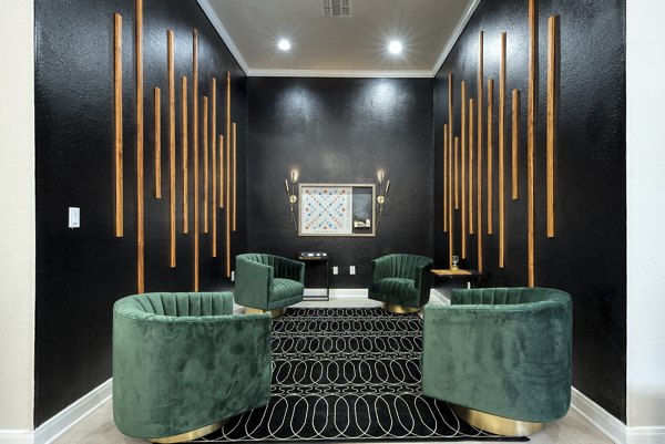 Game room with billiards table and lounge seating at Parc at Wall Street Apartments