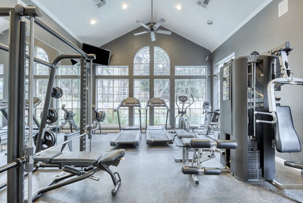 Modern fitness center with state-of-the-art equipment at Parc at Wall Street Apartments for residents seeking an active lifestyle
