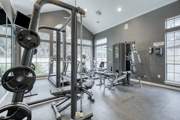Spacious fitness center with modern equipment at Parc at Wall Street Apartments