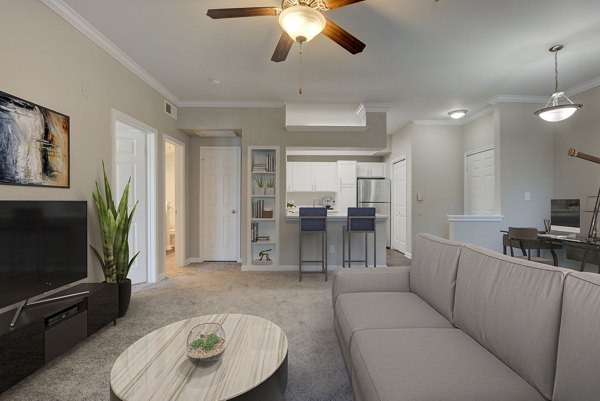 Spacious living room with stylish decor at Parc at Wall Street Apartments