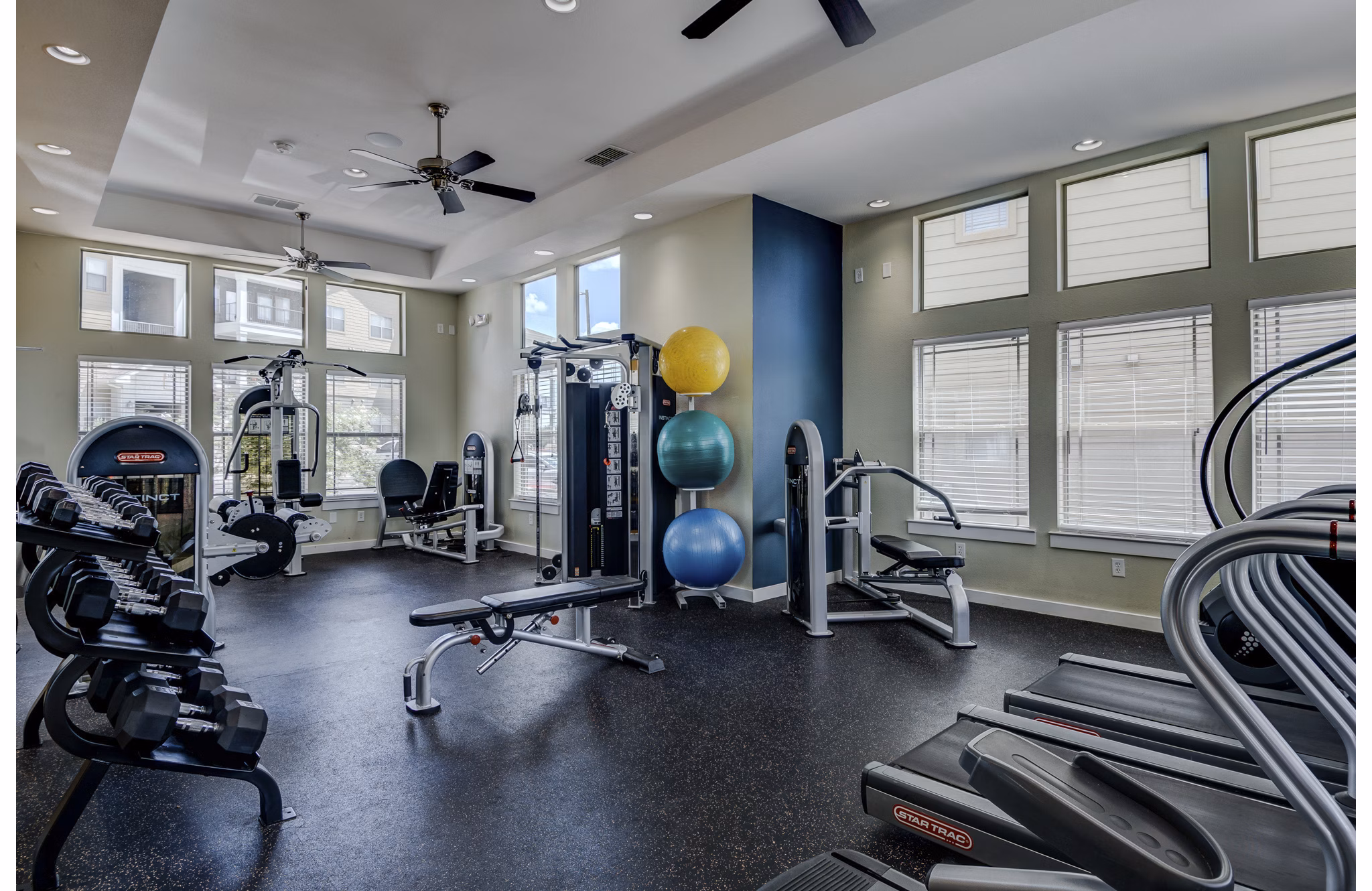 State-of-the-art fitness center with modern equipment at La Contessa Apartments, offering a premium workout experience for residents