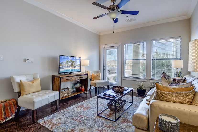 Elegant living room with modern decor in La Contessa Apartments, showcasing luxury living and stylish design