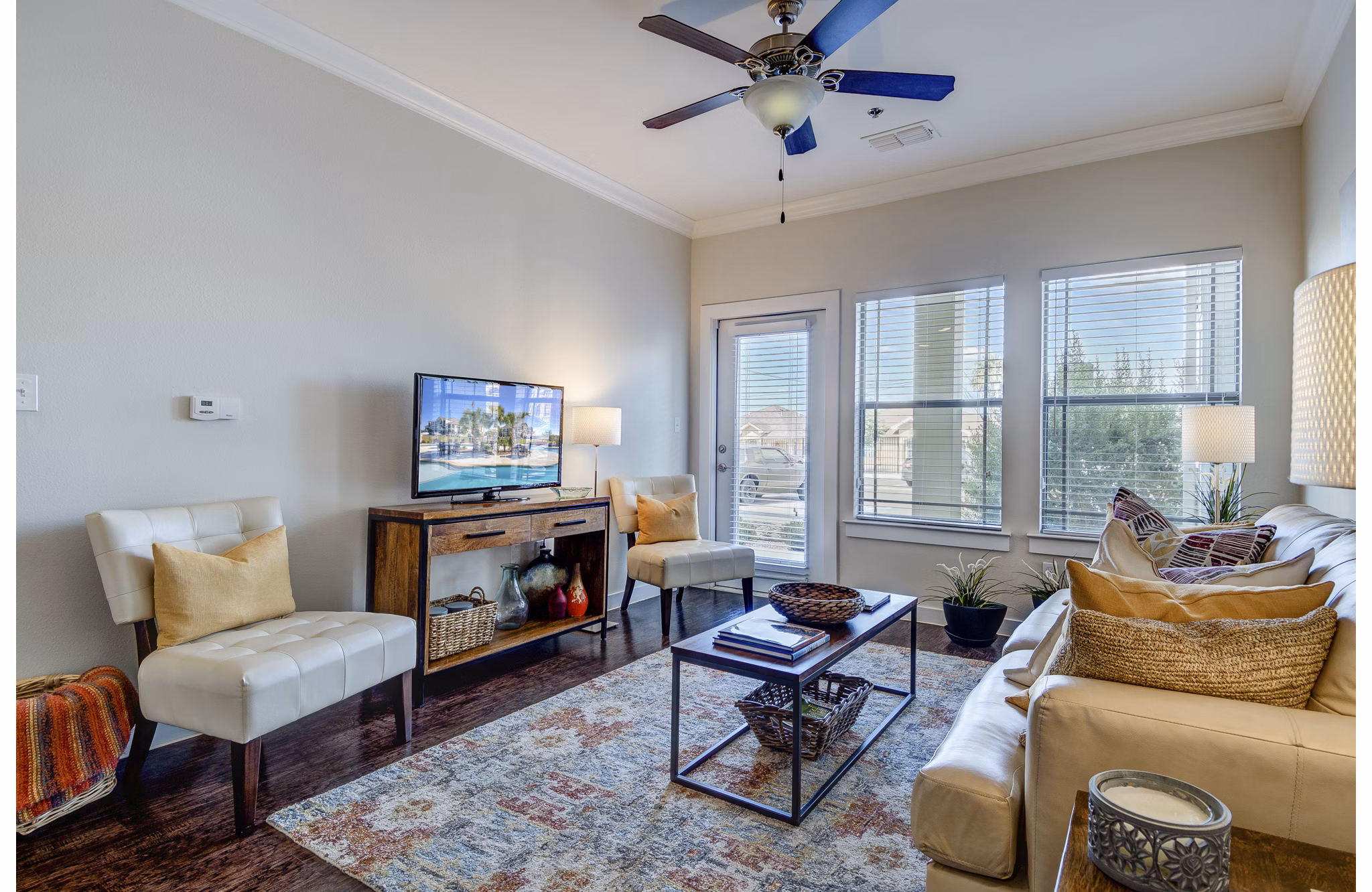 Elegant living room with modern decor in La Contessa Apartments, showcasing luxury living and stylish design