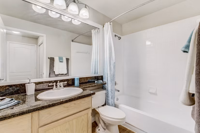 Bathroom featuring modern fixtures and elegant design at Riviera at West Village Apartments