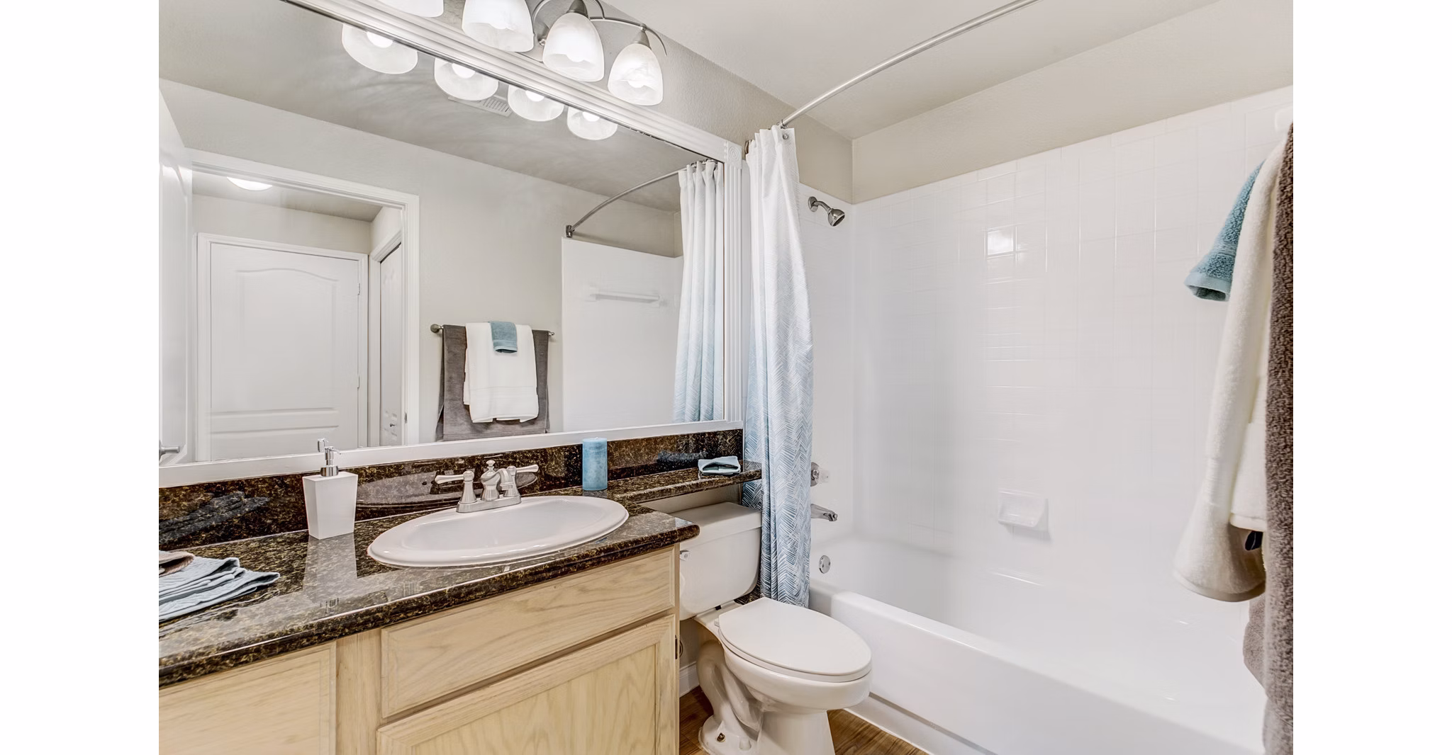 Bathroom featuring modern fixtures and elegant design at Riviera at West Village Apartments