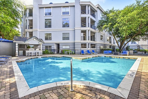 Stylish outdoor pool at Riviera at West Village Apartments, a luxury Greystar community
