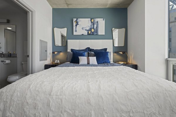 Cozy bedroom with modern decor in Skyhouse Uptown North Apartments