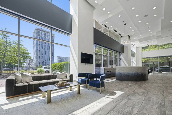 Clubhouse featuring modern decor and lounge areas at Skyhouse Uptown North Apartments