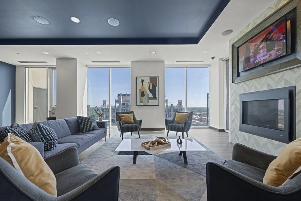 Elegant clubhouse with modern decor at Skyhouse Uptown North Apartments, perfect for hosting events and gatherings