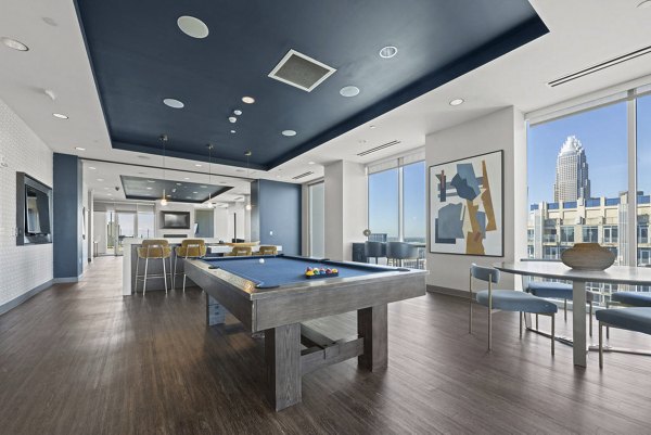 Clubhouse featuring modern design and cozy seating at Skyhouse Uptown North Apartments