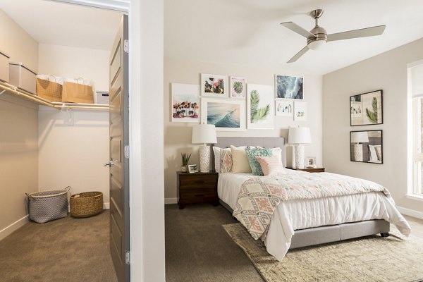 Bedroom featuring modern decor and cozy furnishings at Solana Olde Town Station Apartments