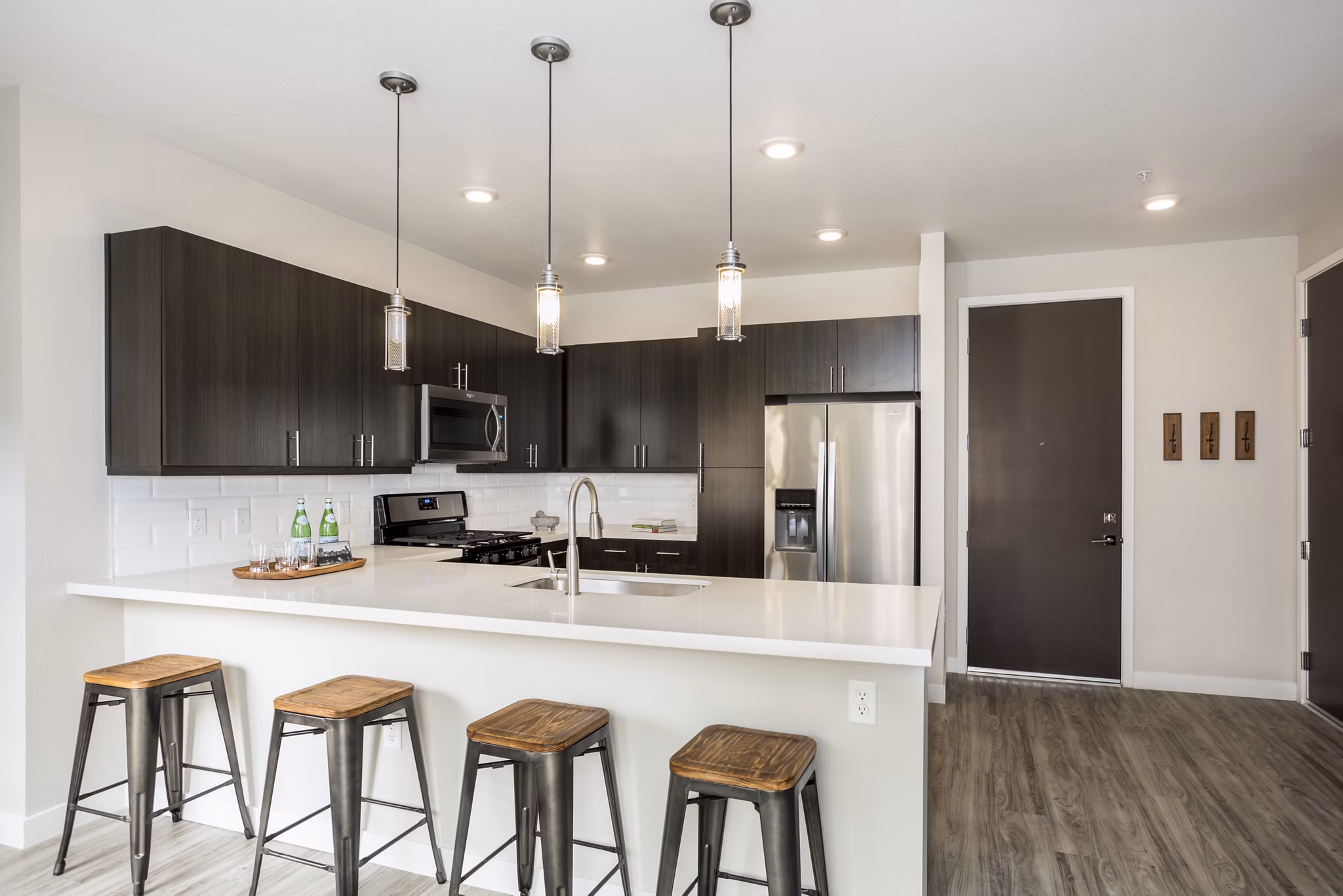 Modern kitchen featuring stainless steel appliances at Solana Olde Town Station Apartments, Greystar luxury apartments