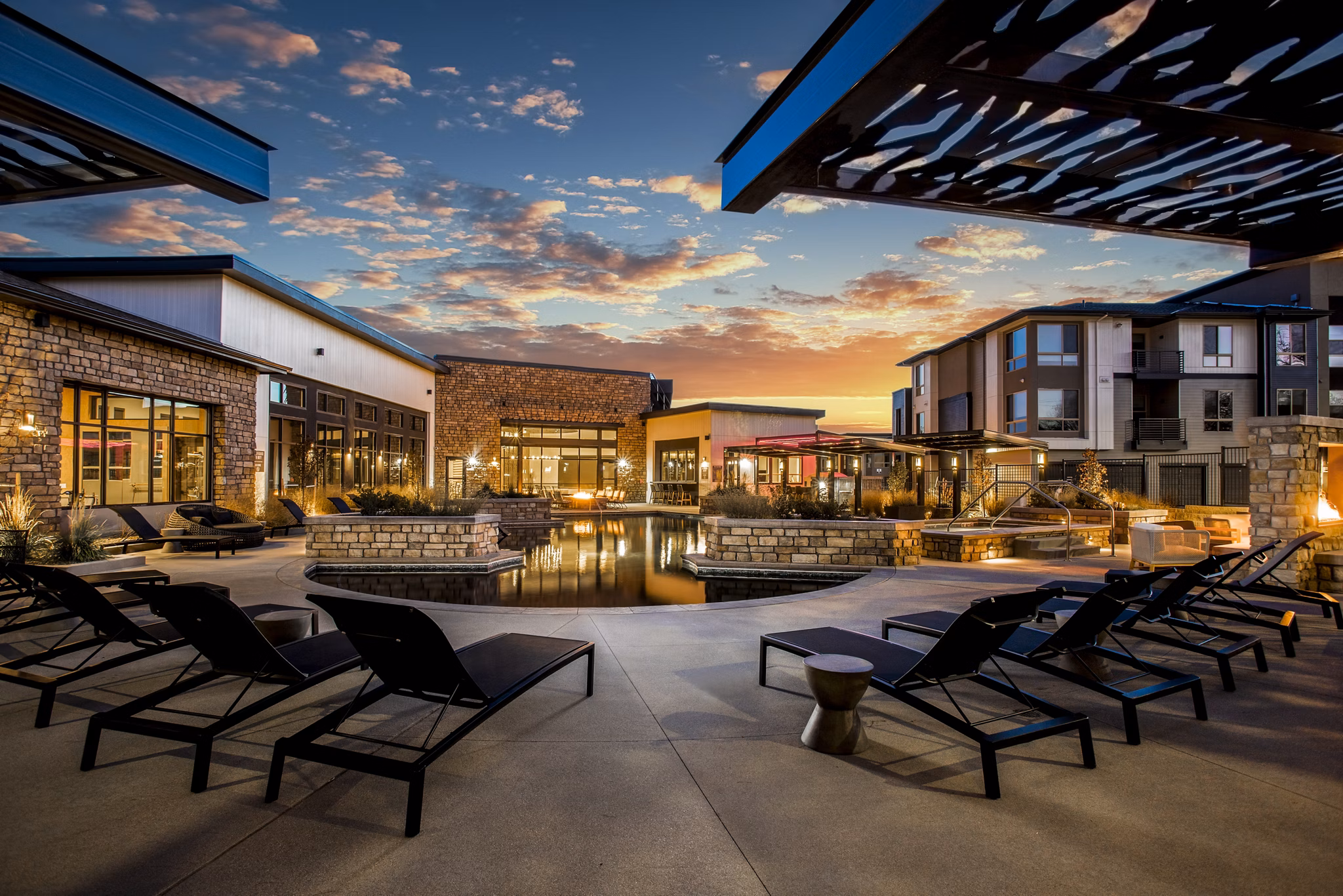Luxury pool area with sundeck at Solana Olde Town Station Apartments