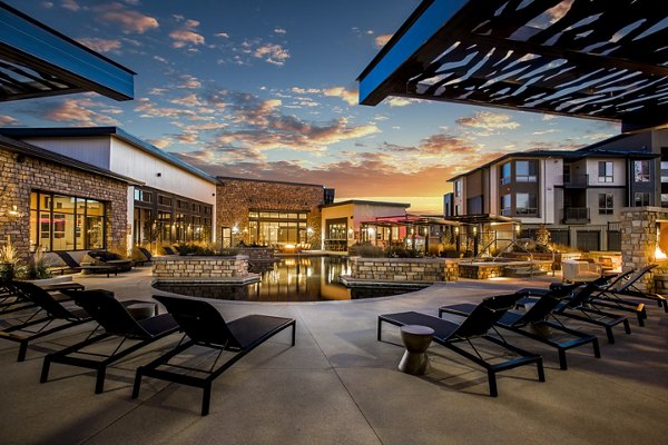 Luxury pool area with sundeck at Solana Olde Town Station Apartments