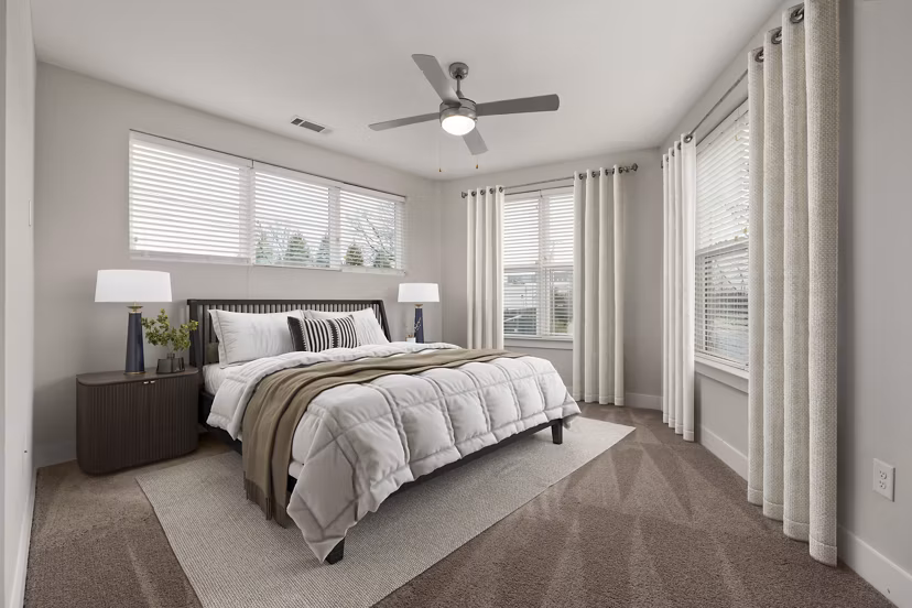 Luxurious bedroom with contemporary decor at Cadence Music Factory Apartments, offering a stylish retreat in urban Charlotte